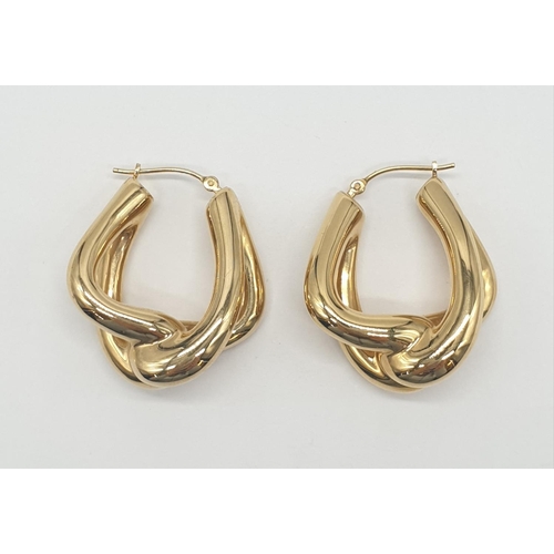 527 - A pair of 14ct gold earrings, weight 4.3g