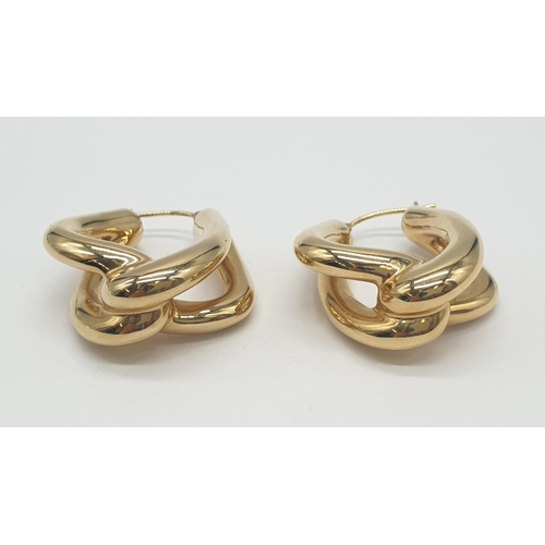 527 - A pair of 14ct gold earrings, weight 4.3g