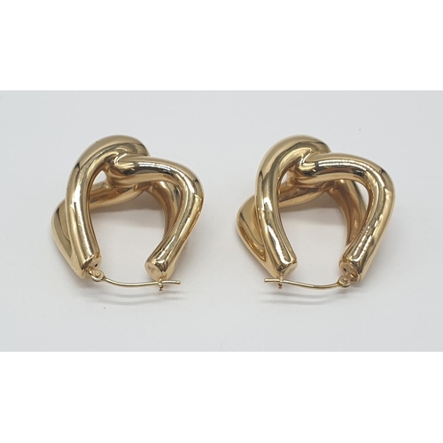 527 - A pair of 14ct gold earrings, weight 4.3g