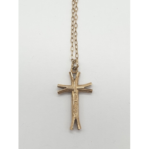 535 - 9ct gold cross on a 9ct gold 44cm long chain, weight 2.3g