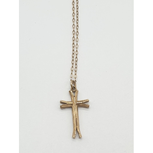 535 - 9ct gold cross on a 9ct gold 44cm long chain, weight 2.3g