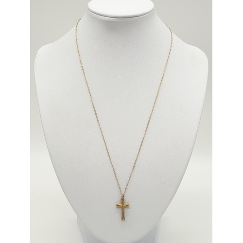 535 - 9ct gold cross on a 9ct gold 44cm long chain, weight 2.3g