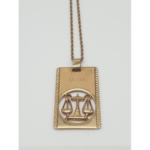 539 - 9ct gold rectangular scaled pendant on a 9ct gold 50cm chain, weight 3.5g