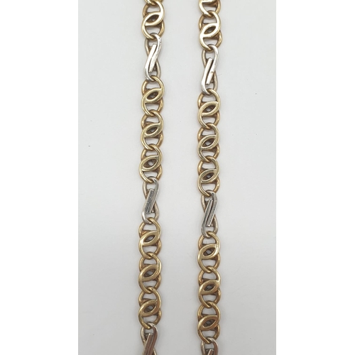 547 - An interlink necklace in white and yellow gold gold, weight 21.2g and 48cm long approx