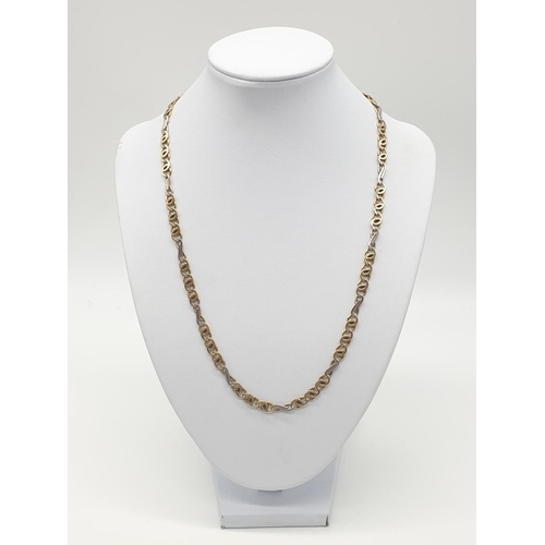 547 - An interlink necklace in white and yellow gold gold, weight 21.2g and 48cm long approx