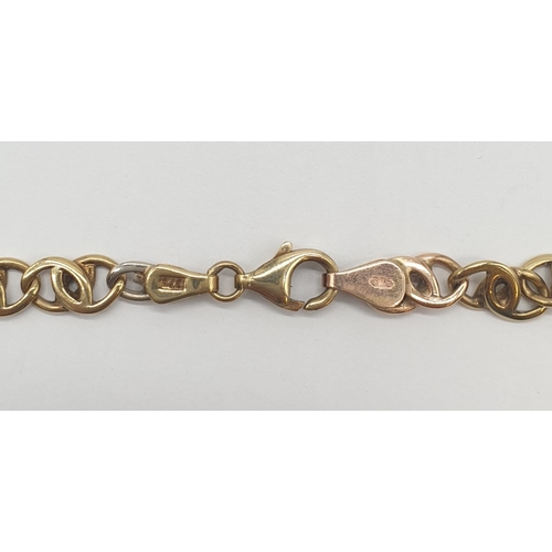 547 - An interlink necklace in white and yellow gold gold, weight 21.2g and 48cm long approx