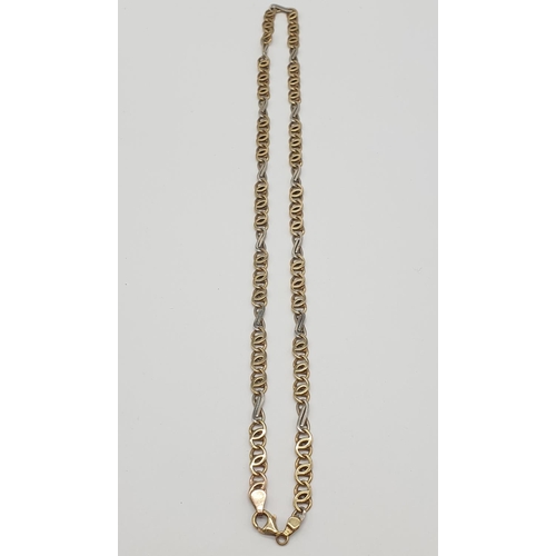 547 - An interlink necklace in white and yellow gold gold, weight 21.2g and 48cm long approx