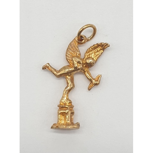 553 - Yellow metal charm/pendant of cupid, weight 1.6g and 25mm long approx