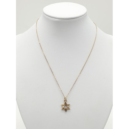 577 - 9ct gold small star of David on a 9ct 38cm chain.