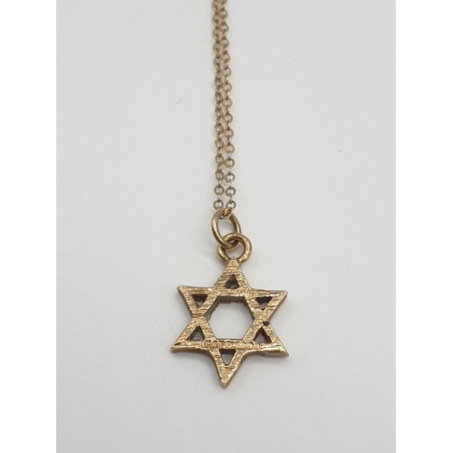 577 - 9ct gold small star of David on a 9ct 38cm chain.