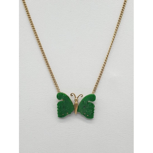 581 - Jade butterfly necklace on 9ct gold weighs 5gm, 38cm.