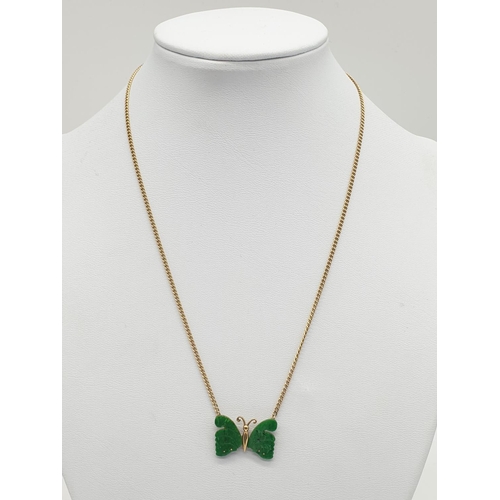 581 - Jade butterfly necklace on 9ct gold weighs 5gm, 38cm.