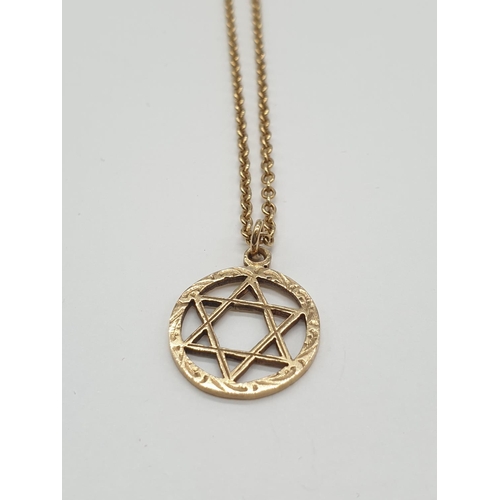 586 - Star of David pendant in 9ct gold on a 46cm 9ct gold chain. Weight is 4.6gm.