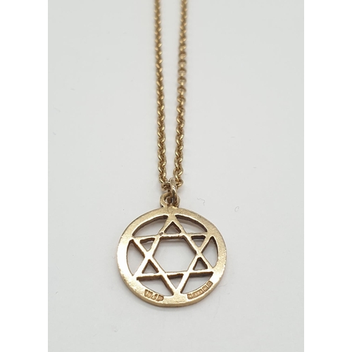 586 - Star of David pendant in 9ct gold on a 46cm 9ct gold chain. Weight is 4.6gm.