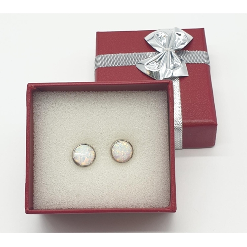 591 - Silver and opal set circular earrings, boxed