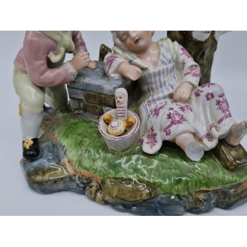 385 - Meissen ceramic statue of boy and girl. 22cm tall by 21cm wide.