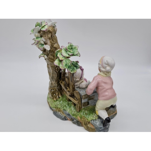 385 - Meissen ceramic statue of boy and girl. 22cm tall by 21cm wide.