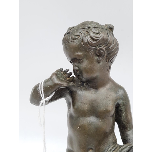 389 - Bronze statue of naked boy 22cm tall, weight 1.4kg.