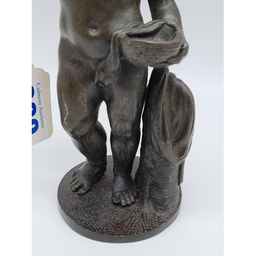 389 - Bronze statue of naked boy 22cm tall, weight 1.4kg.