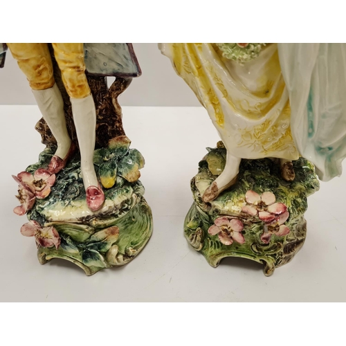 468 - Two tall ceramic figures of violin player and lady. Slight damage to to violin players hand.