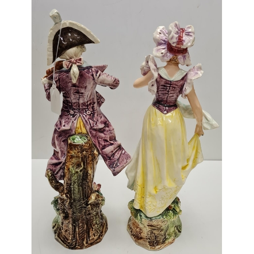 468 - Two tall ceramic figures of violin player and lady. Slight damage to to violin players hand.