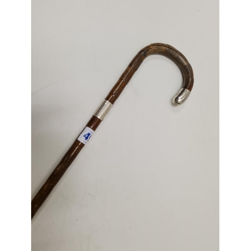 492 - Antique Bamboo Walking Stick with silver trim 33cm length, slight split on the handle.