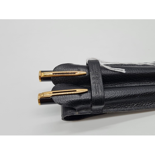 574 - Waterman 2 pen set in leather case 1 fountain pen with 14ct gold nib, 1 ball point pen.