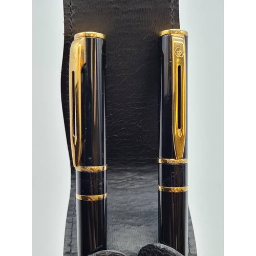 574 - Waterman 2 pen set in leather case 1 fountain pen with 14ct gold nib, 1 ball point pen.