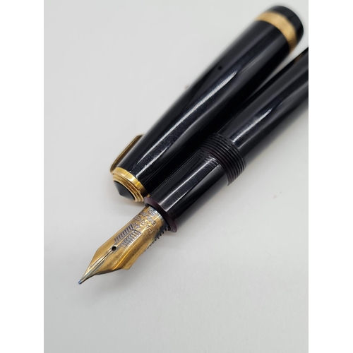 575 - 1950s parker duo fold fountain pen with a 14ct gold nib.