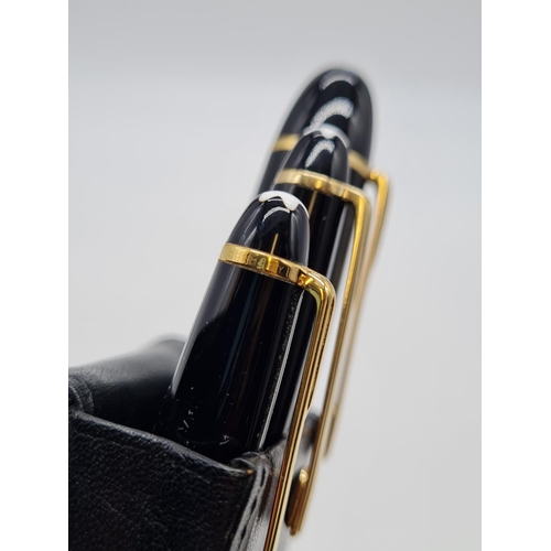 576 - Mont blanc 3 pen set in a leather case the fountain pen has a 14ct gold nib.