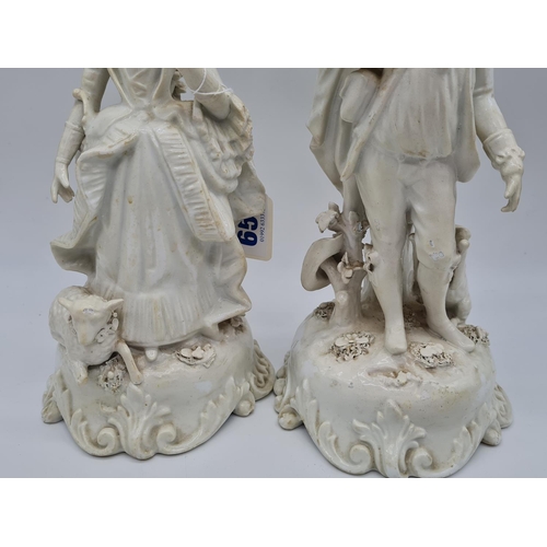 656 - Pair of Meissen candlesticks with added foliage. 25cm tall, weight 2.6kg.