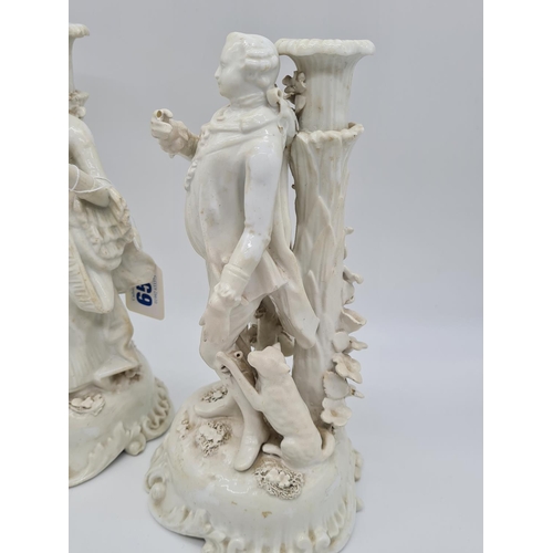 656 - Pair of Meissen candlesticks with added foliage. 25cm tall, weight 2.6kg.