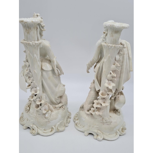 656 - Pair of Meissen candlesticks with added foliage. 25cm tall, weight 2.6kg.