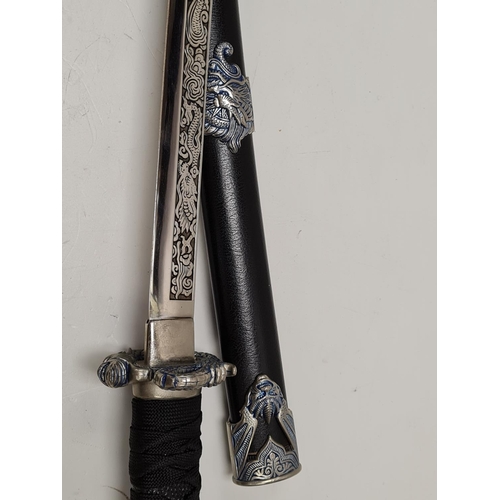 658 - Japanese katana sword with dragon head decorated handle and scabbard.