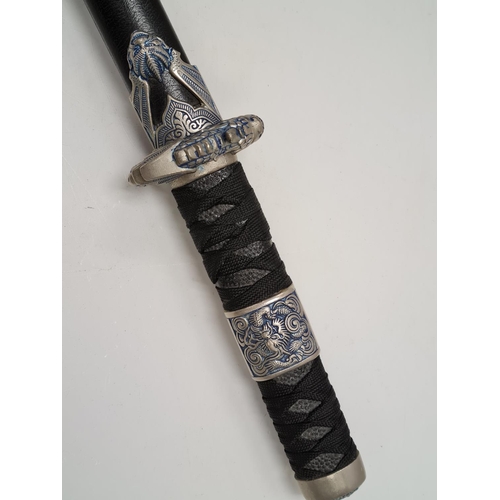 658 - Japanese katana sword with dragon head decorated handle and scabbard.