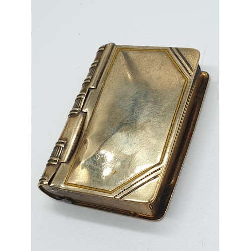 558 - Unusual double use vesta in yellow metal with a stamp holder at the back and being spring loaded, we... 