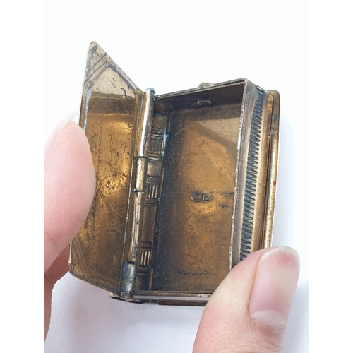 558 - Unusual double use vesta in yellow metal with a stamp holder at the back and being spring loaded, we... 