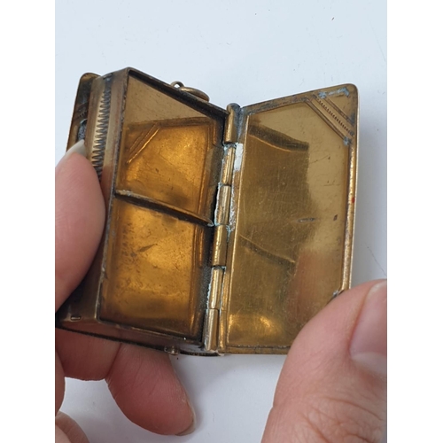 558 - Unusual double use vesta in yellow metal with a stamp holder at the back and being spring loaded, we... 