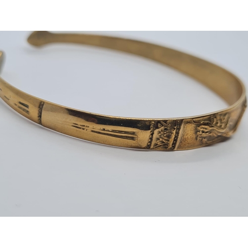 405 - Vintage yellow metal bangle, believed to be oriental with dragon motif. 14.5g.