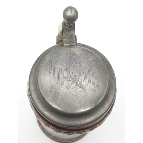 71 - WW2 German Lidded Stein with closed wing eagle and swastika on the lid.