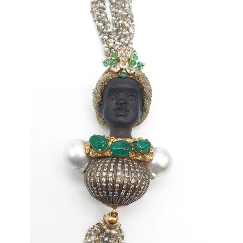 283 - An Ebony headed pendant decorated with diamonds and emerald with baroque pearl shoulders on a 68cm c... 