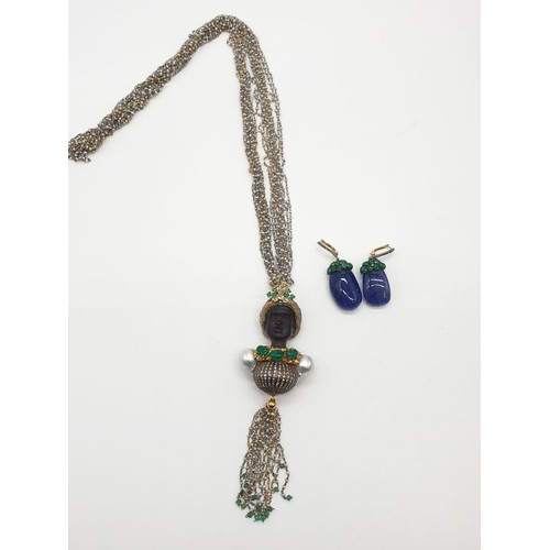 283 - An Ebony headed pendant decorated with diamonds and emerald with baroque pearl shoulders on a 68cm c... 