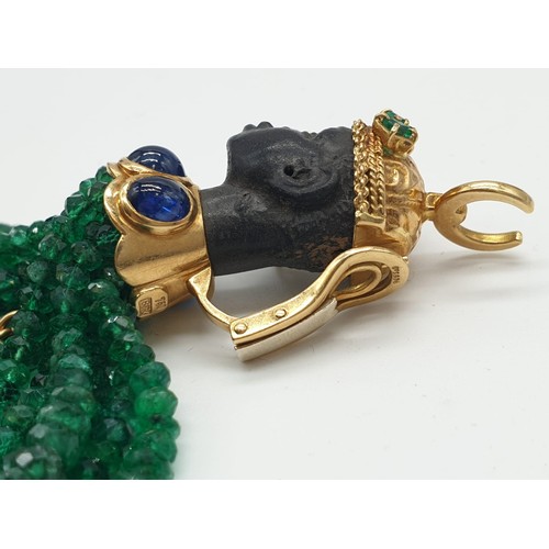 118 - An unusual brooch and earring set, set in 18ct gold and having emerald, sapphire, ruby and diamonds ... 