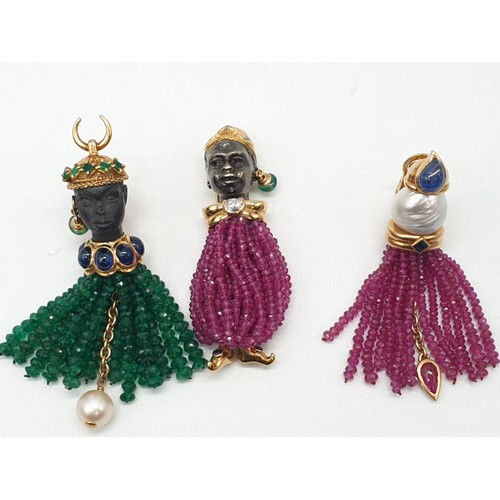 118 - An unusual brooch and earring set, set in 18ct gold and having emerald, sapphire, ruby and diamonds ... 