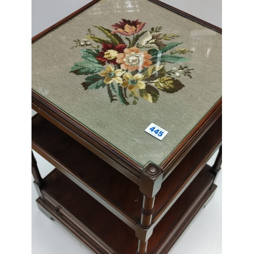 445 - An occasional Table with 2 shelves and bottom draw with an embroidery  under glass top 46 x 46 cm & ... 