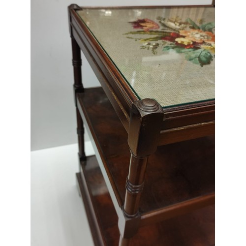 445 - An occasional Table with 2 shelves and bottom draw with an embroidery  under glass top 46 x 46 cm & ... 