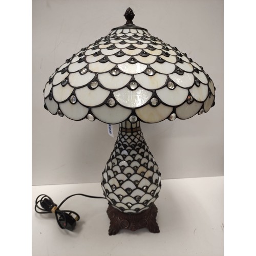 489 - Tiffany style mushroom Lamp 60 cms tall and 42 cm diameter. Scratched on one panel.