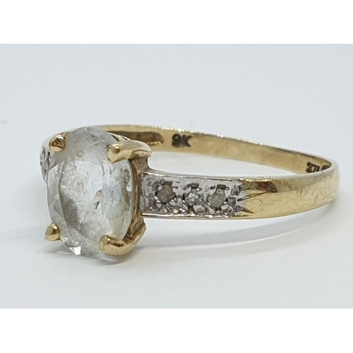 144 - Vintage 9ct Gold Ring with unknown centre stone and diamond shoulders, 1.1g size O