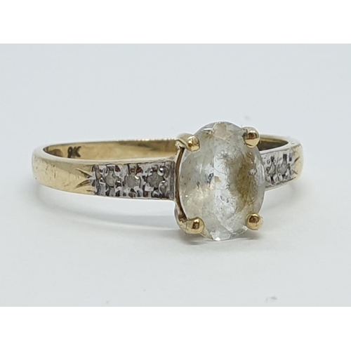 144 - Vintage 9ct Gold Ring with unknown centre stone and diamond shoulders, 1.1g size O