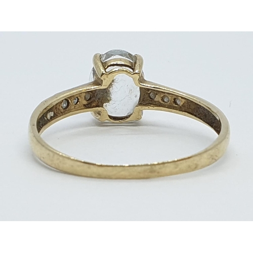 144 - Vintage 9ct Gold Ring with unknown centre stone and diamond shoulders, 1.1g size O